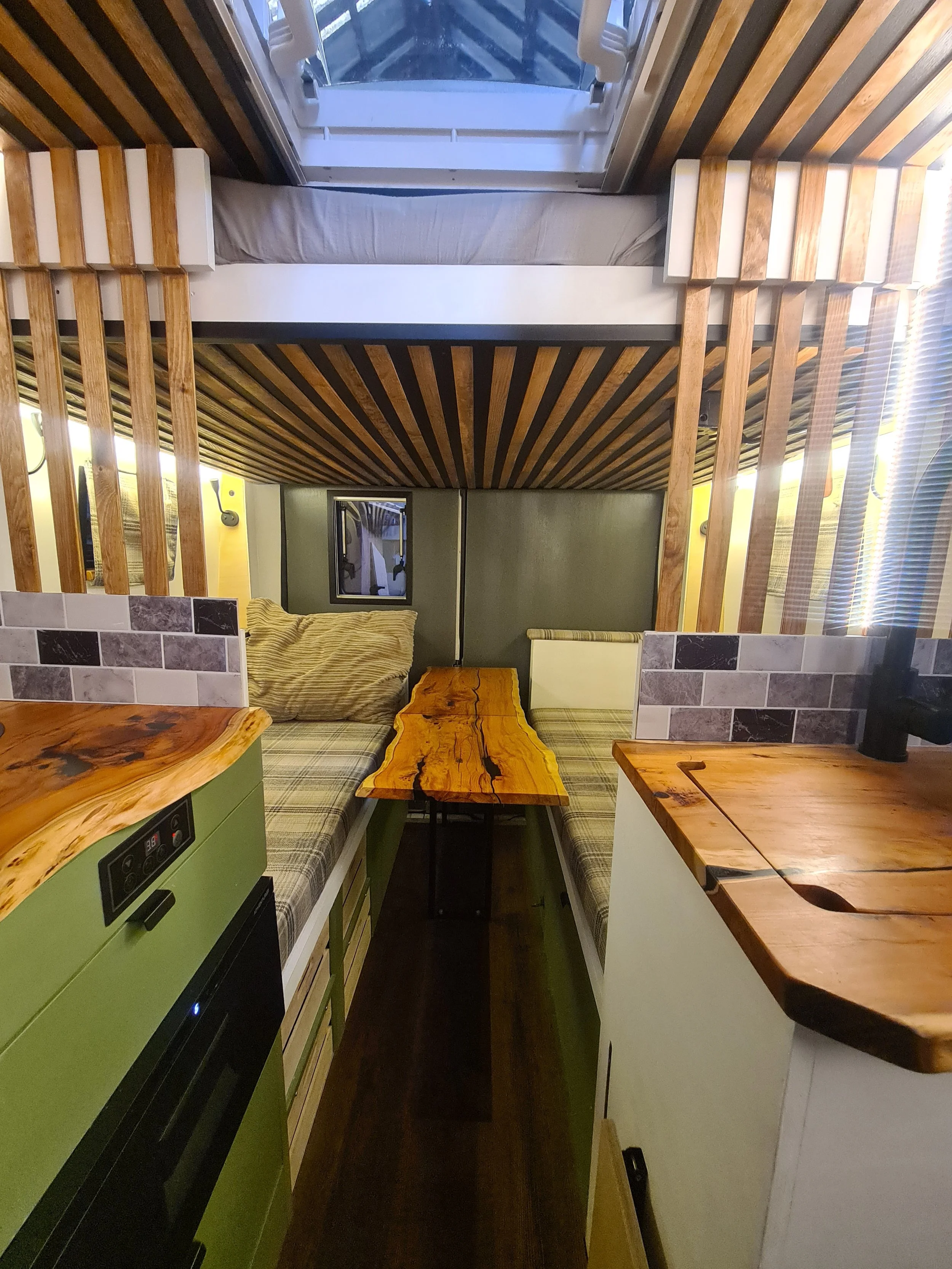 SWB Fiat Ducato. Fully off grid, Gas free, Lifting bed, Seating for 4, Live edge yew table, Kitchen, Full height wardrobe, Composting toilet. Photo 9 of 22.