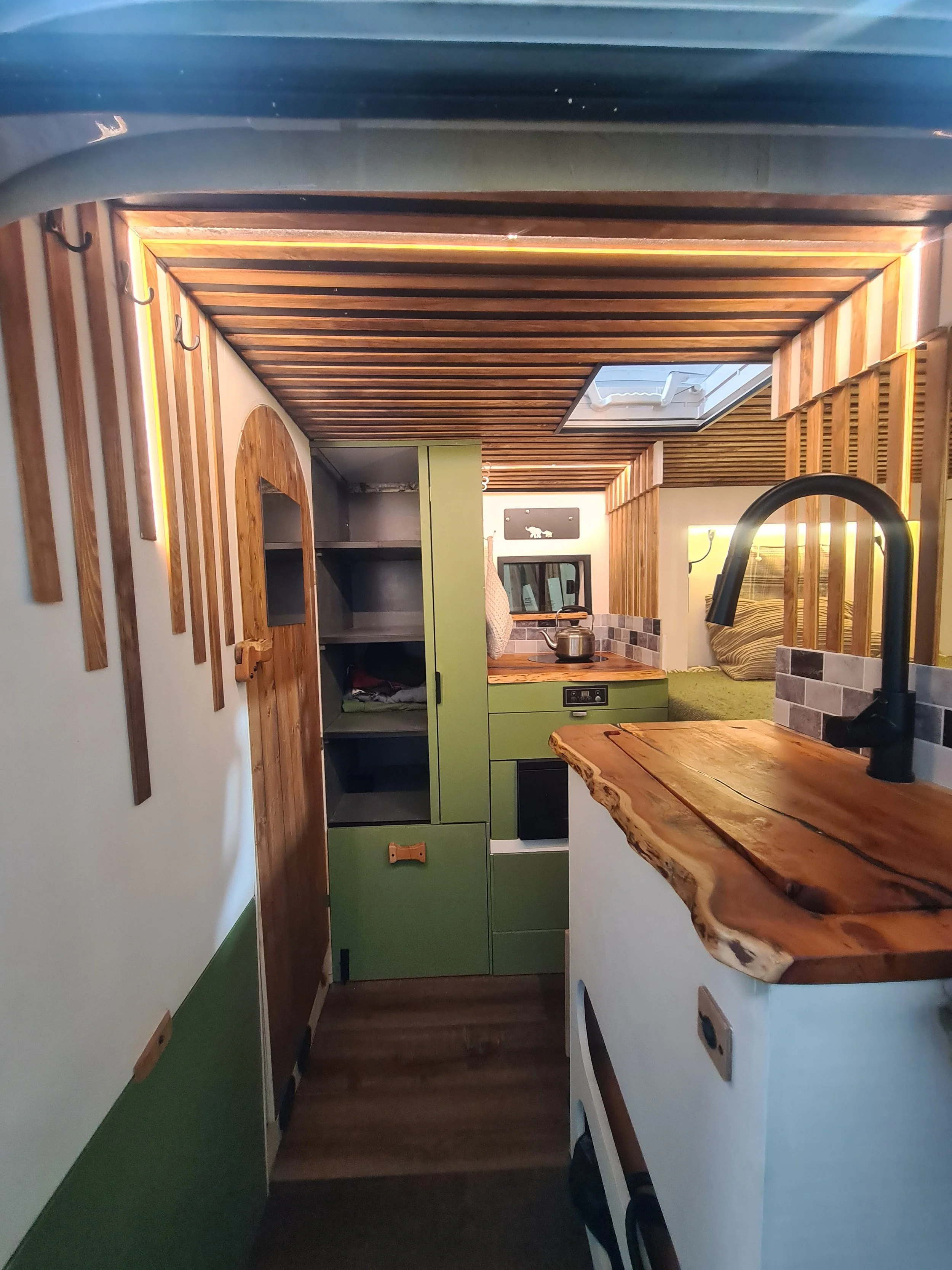 SWB Fiat Ducato. Fully off grid, Gas free, Lifting bed, Seating for 4, Live edge yew table, Kitchen, Full height wardrobe, Composting toilet. Photo 4 of 22.