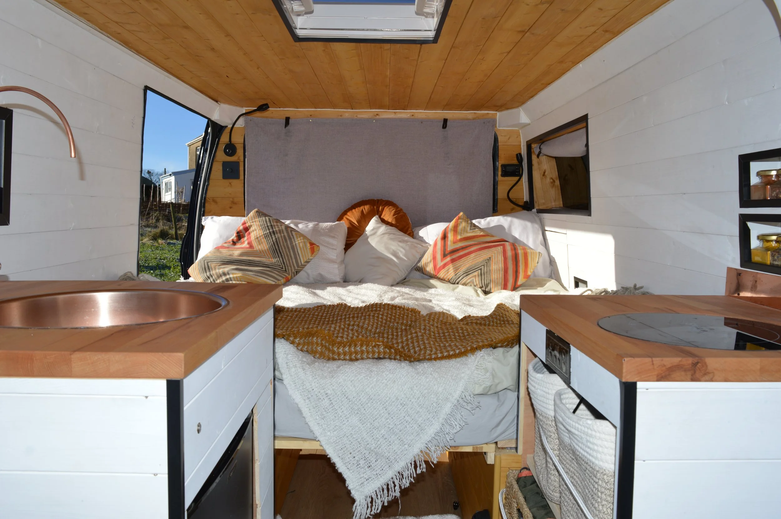Luna. U shaped seating, Extra large king sized bed, Rear kitchen, Off-grid, Gas free, Induction hob, Fridge.