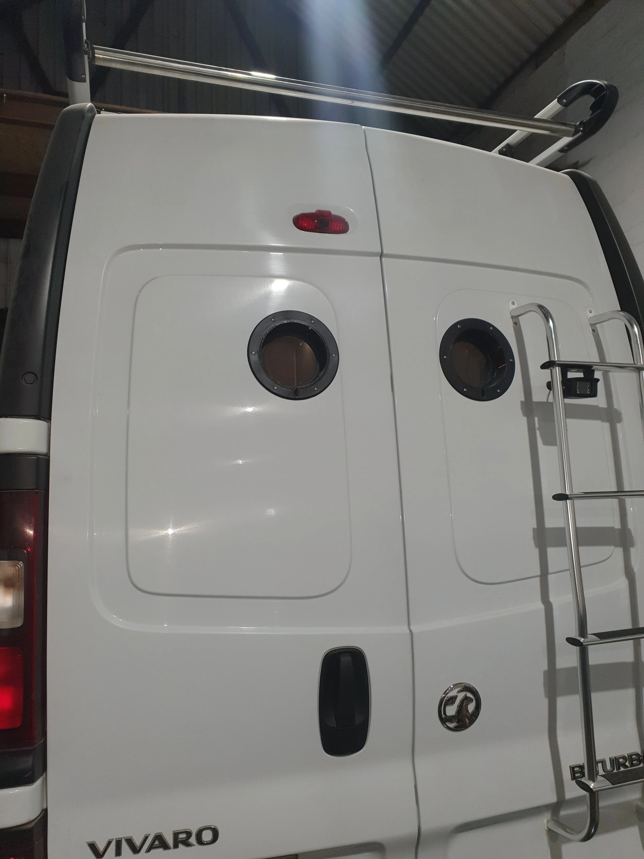 High-roof Vauxhall Vivaro. Semi-fixed bed, Garage space, Heated drying room, Pull out rails, Copper tap, Epoxy poured oak worksurface, Butlers sink, 2 ring hob. Photo 3 of 9.