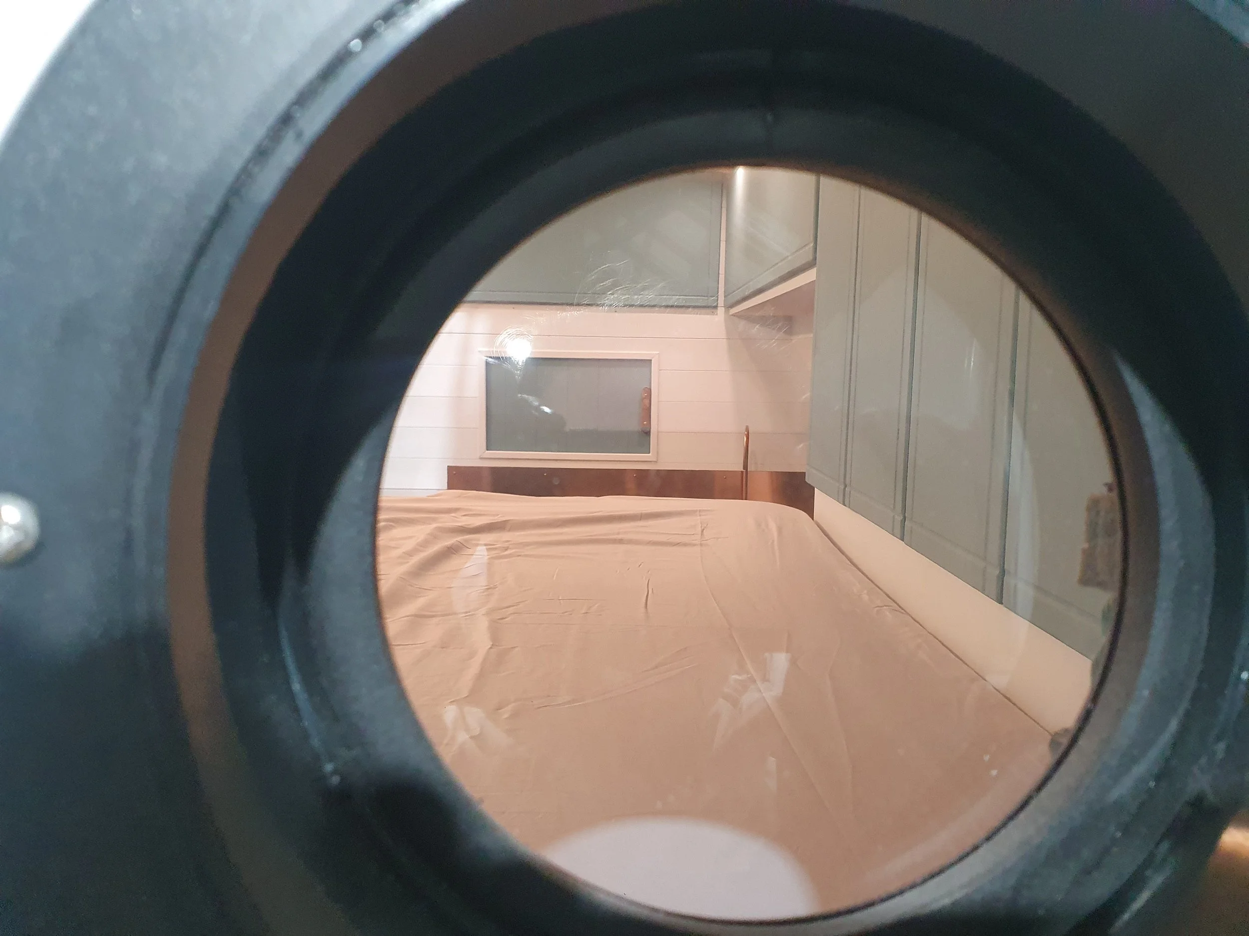 High-roof Vauxhall Vivaro. Semi-fixed bed, Garage space, Heated drying room, Pull out rails, Copper tap, Epoxy poured oak worksurface, Butlers sink, 2 ring hob. Photo 5 of 9.