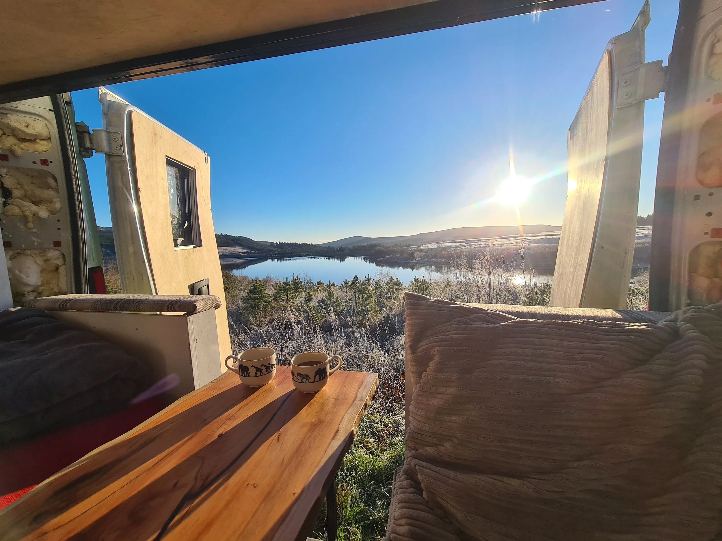 SWB Fiat Ducato. Fully off grid, Gas free, Lifting bed, Seating for 4, Live edge yew table, Kitchen, Full height wardrobe, Composting toilet. Photo 21 of 22.