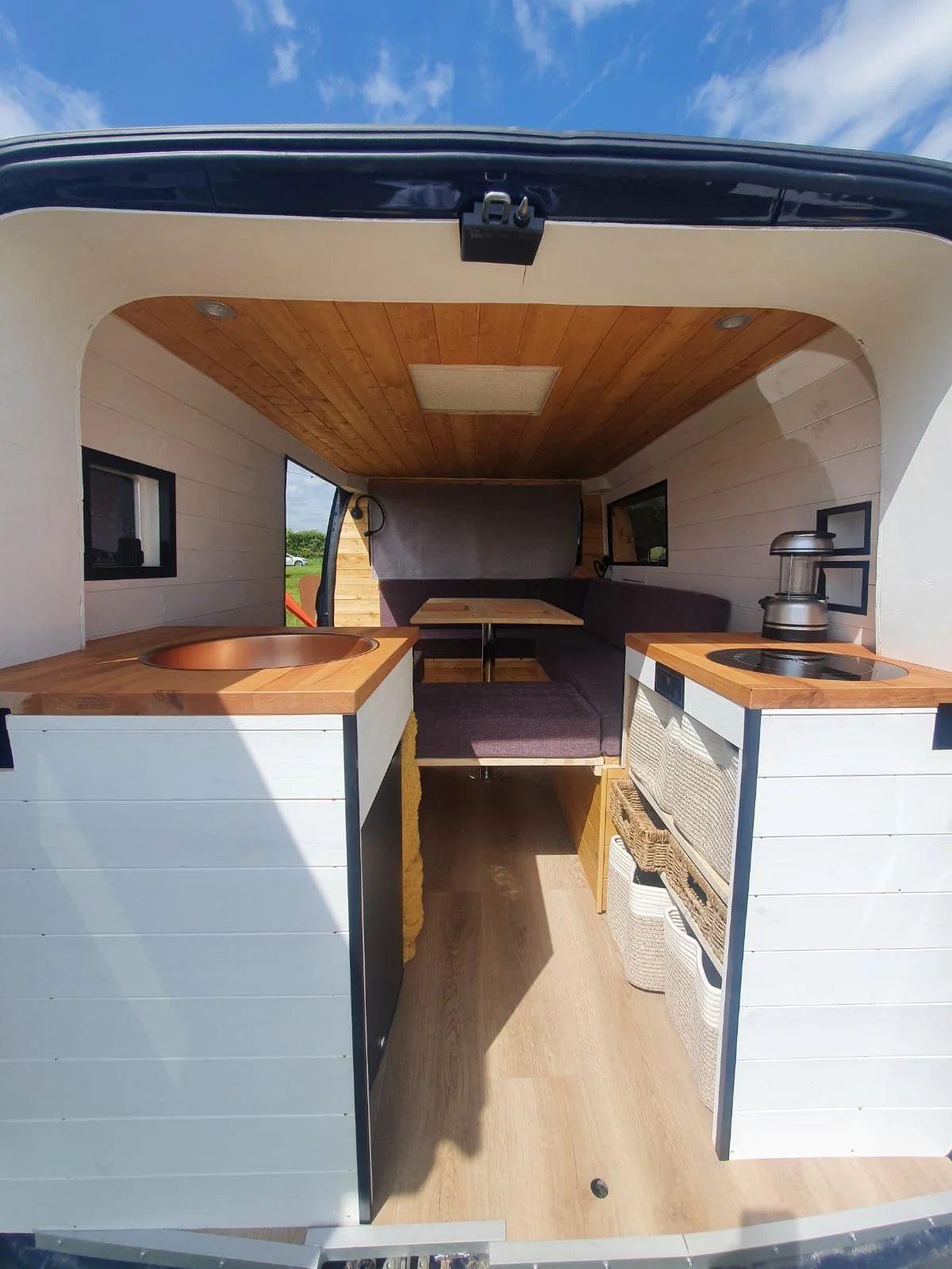 Luna. U shaped seating, Extra large king sized bed, Rear kitchen, Off-grid, Gas free, Induction hob, Fridge. Photo 8 of 12.