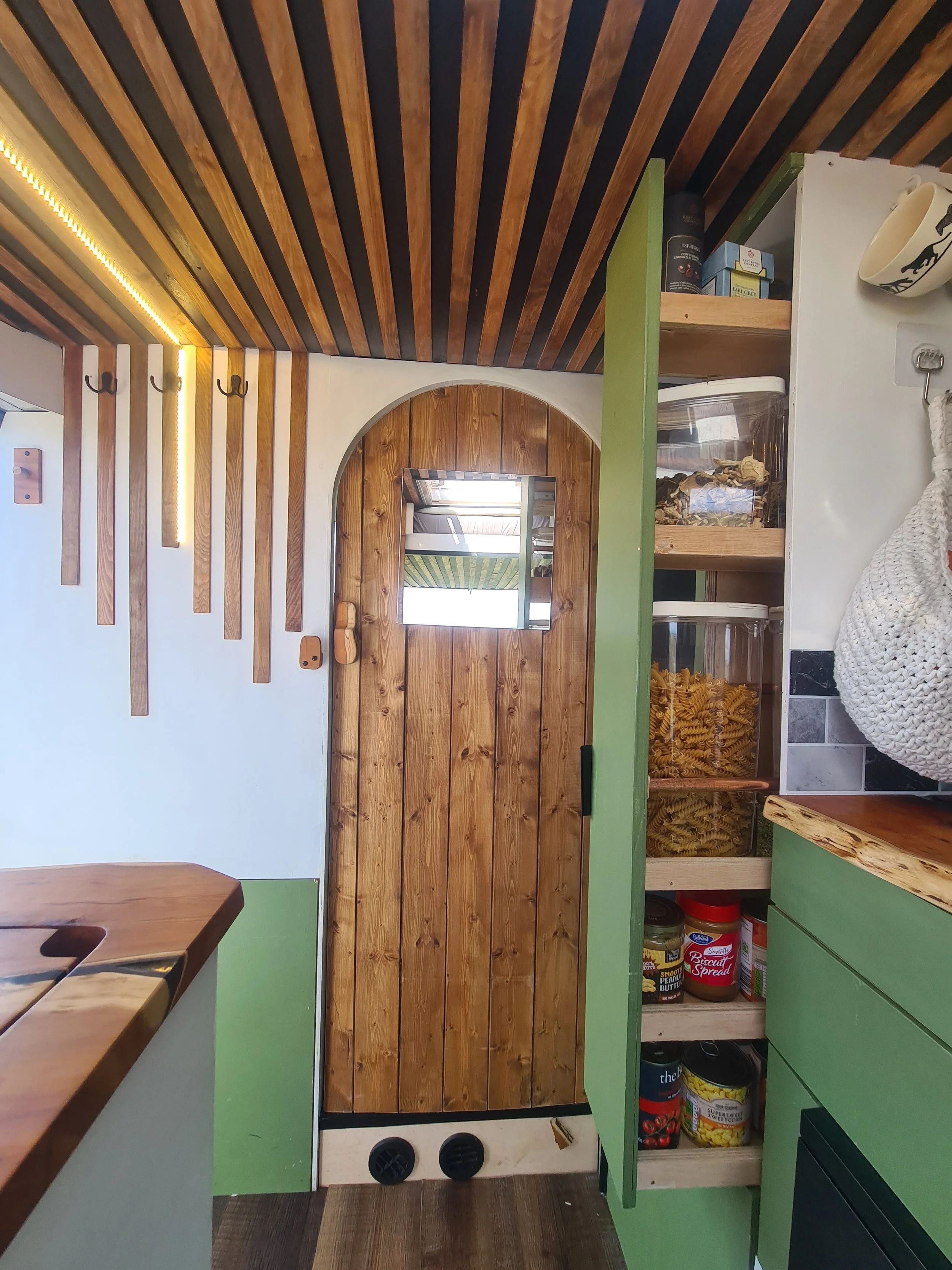 SWB Fiat Ducato. Fully off grid, Gas free, Lifting bed, Seating for 4, Live edge yew table, Kitchen, Full height wardrobe, Composting toilet. Photo 17 of 22.