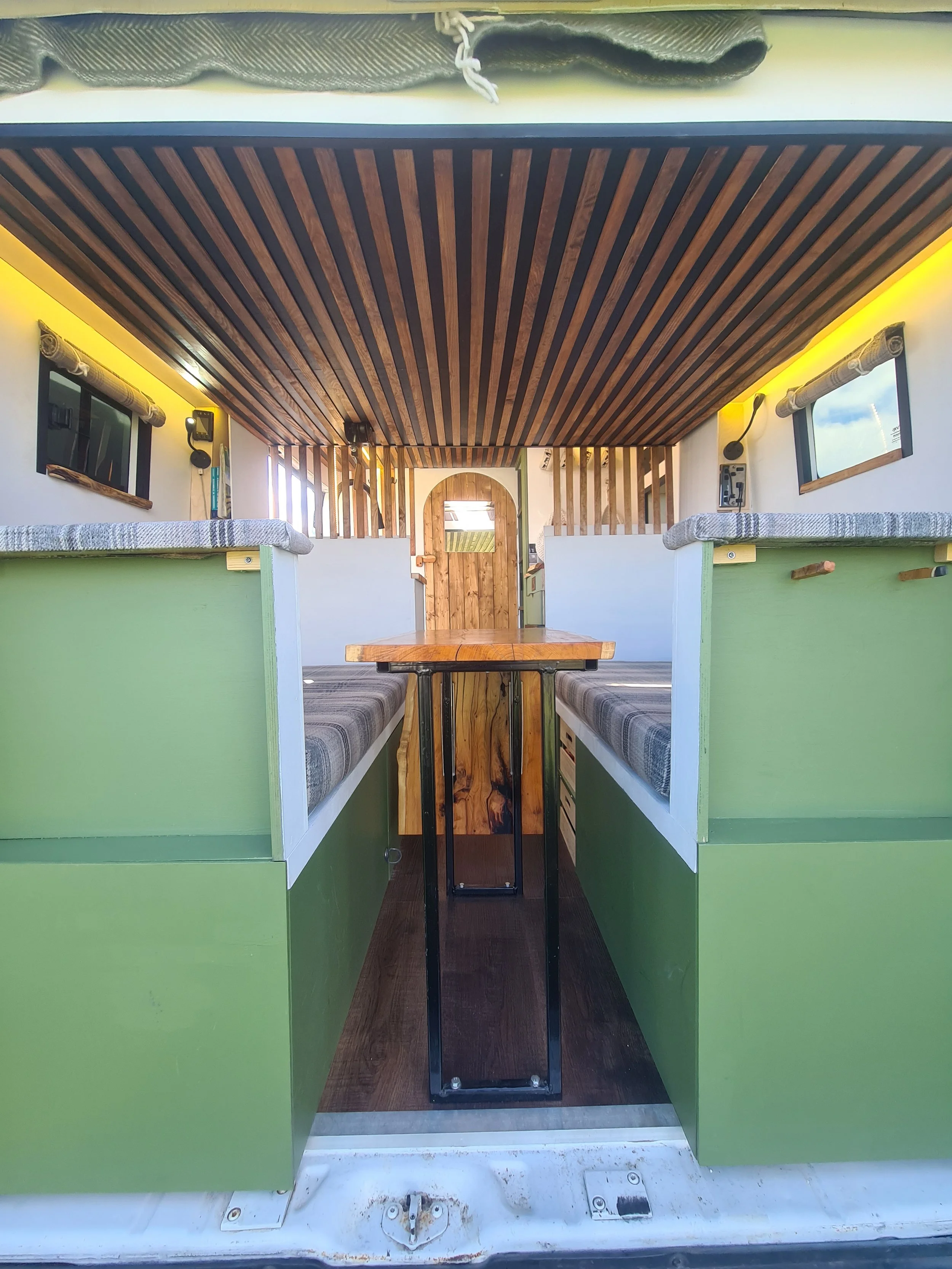 SWB Fiat Ducato. Fully off grid, Gas free, Lifting bed, Seating for 4, Live edge yew table, Kitchen, Full height wardrobe, Composting toilet. Photo 14 of 22.