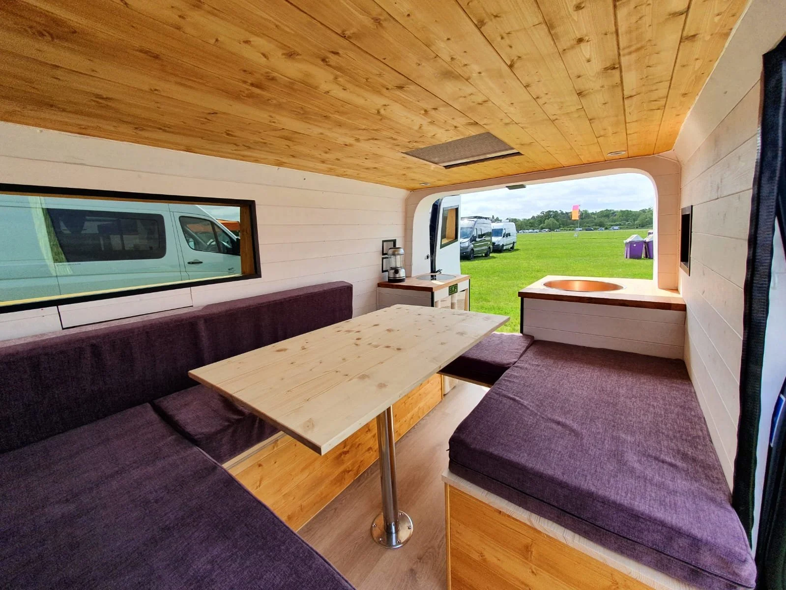 Luna. U shaped seating, Extra large king sized bed, Rear kitchen, Off-grid, Gas free, Induction hob, Fridge. Photo 6 of 12.