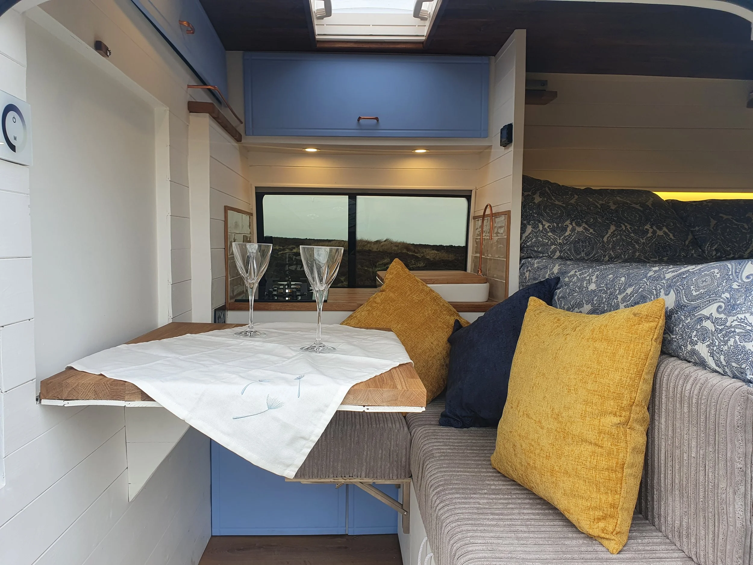 Transit L1H2 2013. Fixed bed, Folding table, Sofas, Kitchenette, Dining area, Copper handles and taps. Photo 2 of 8.
